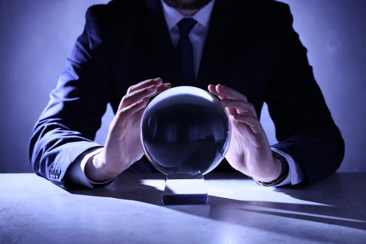 A man in a suit with a crystal ball