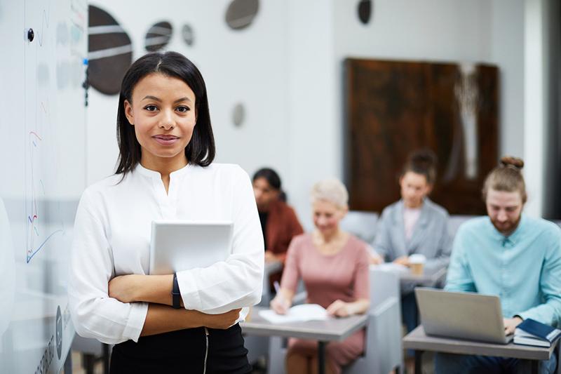Young female teacher in classroom