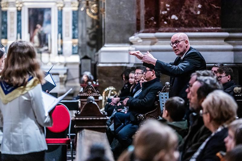 Man conducting a choir and orchestra