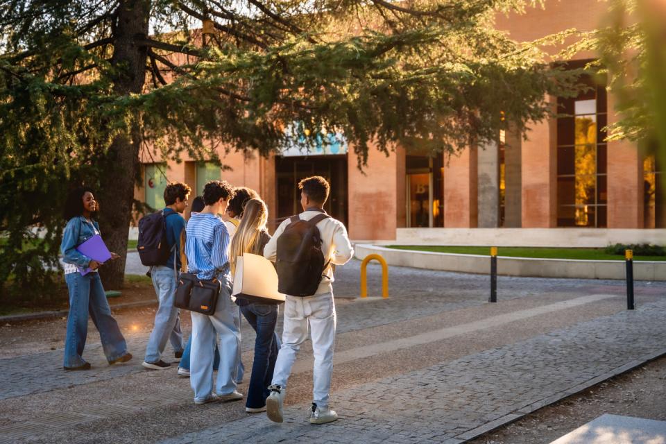 A group of students outside a campus building