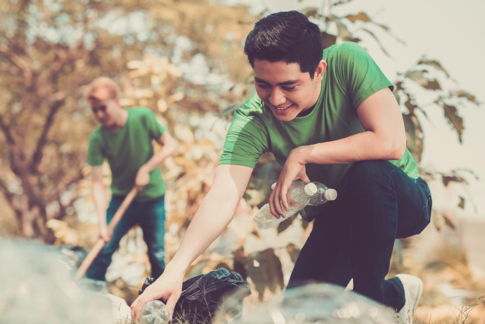 A student picking up litter