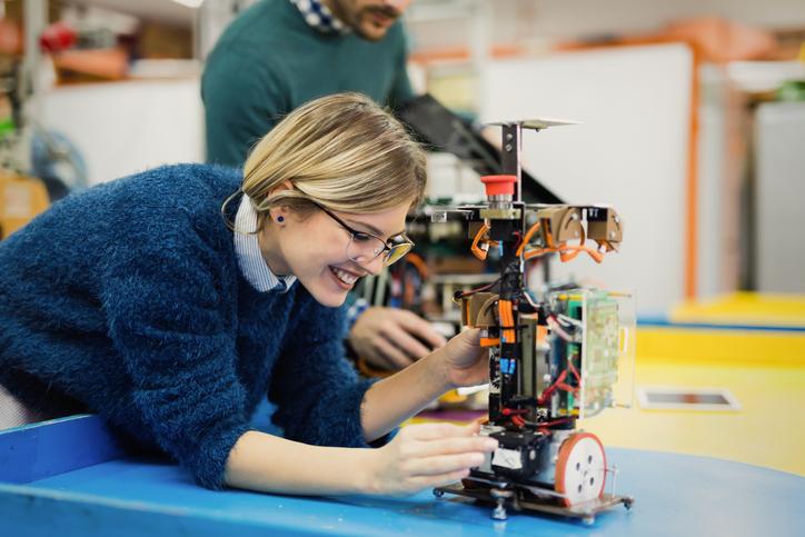 A woman works on an engineering project