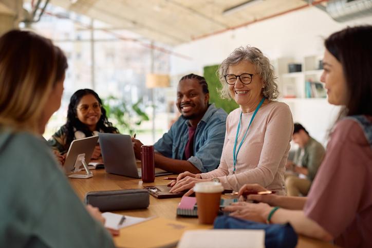 Academics and students talk together