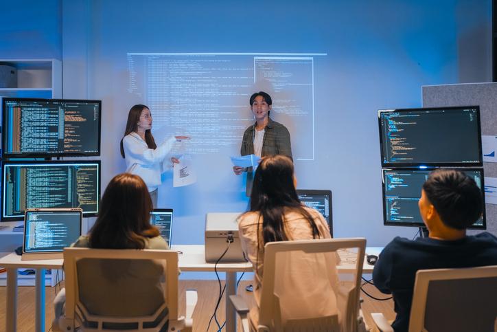 Two academics lead a coding session