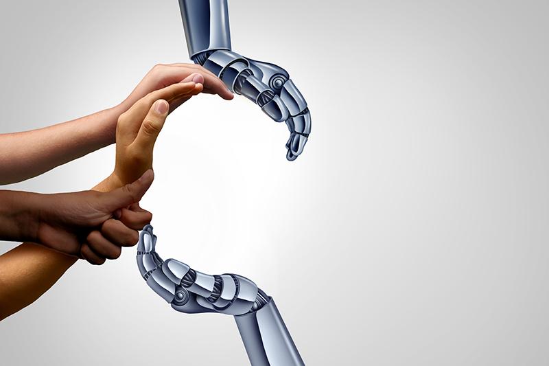 Human and robot hands making a curve shape
