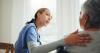 Medical professional talking to a female patient