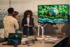 A presentation takes place on a screen featuring an illustration of the Earth