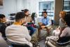 Participants of a focus group chatting in a circle