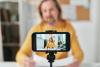 A teacher live streaming from a smart phone