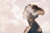 Woman with head in clouds, calm concept