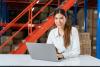 A logistics student working at her laptop