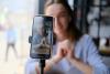A student filming herself on her phone