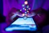 A pair of hands scroll social media on a smartphone