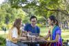 Students chatting in a green space