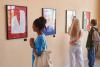 Students observe art in a gallery