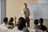 A professor takes a question during a lecture