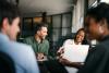 A team of professional services staff haveing a discussion