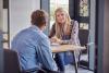 A PhD supervisor speaking to her student in her office