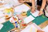 Students using card and paper to create models in class