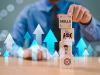 Man stacking wooden blocks to demonstrate building skills