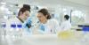 Researchers discuss experiments in a lab