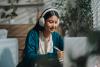 Young female Asian student doing an online course