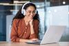 Female student smiling at laptop