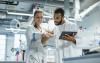 Scientists discuss results in a lab
