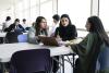 Muslim law students discussing a case in class